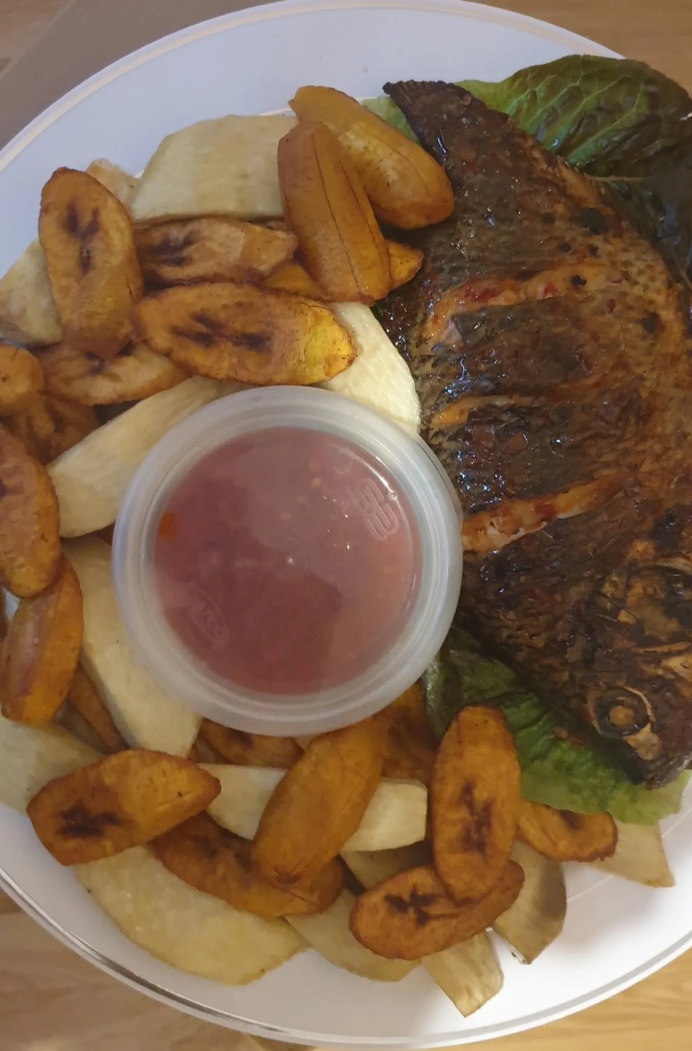 Whole grilled Tilapia fish/yam/sauce